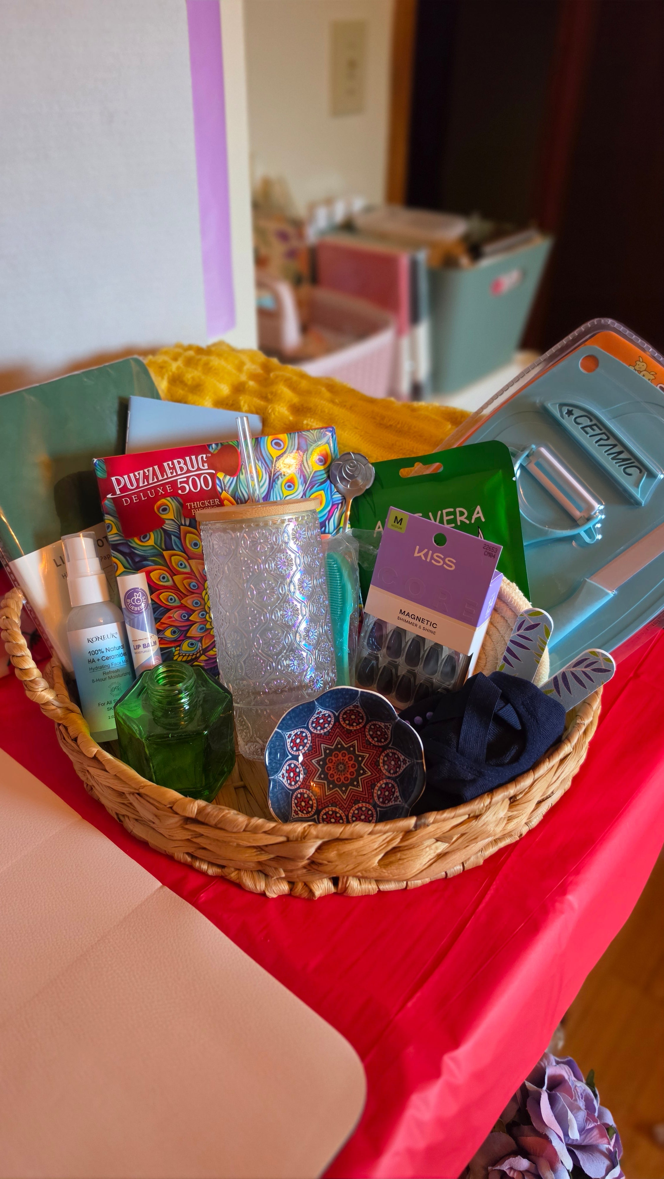 Past Spawberry Curations One Scoop box — a basket filled with a mix of beauty, home, and lifestyle items including skincare, a tumbler, nail products, a puzzle, and more.